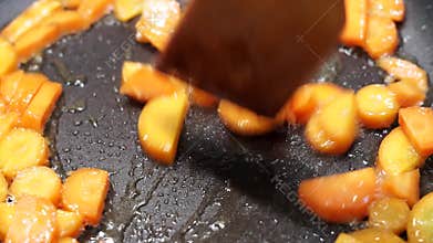 Roasted carrots closeup on oil