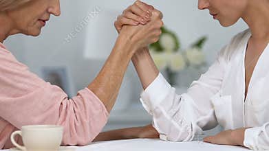 Mother-in-law competing hands with daughter-in-law, fight for title of housewife