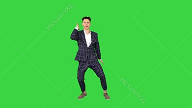 Happy Successful Businessman Dancing In a Crazy Way on a Green Screen, Chroma Key.