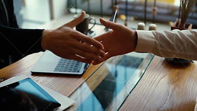 Close-up of the handshake of business partners in slow motion