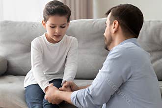 Worried single father comforting upset kid son helping with problem