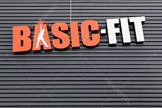 Basic-Fit logo on a wall