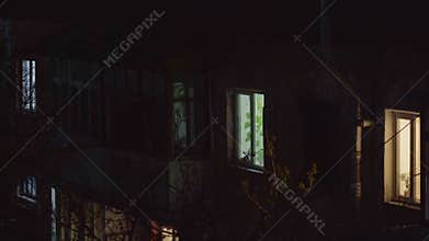 House at night and the light in the window