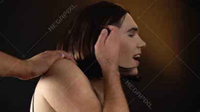 Male touching person in dress looking for woman, but trans man turning to camera
