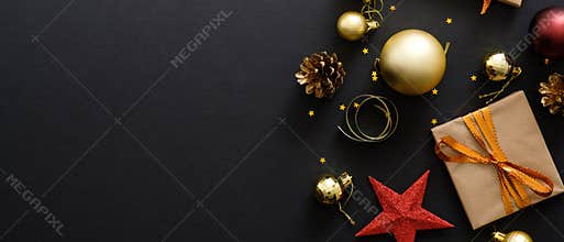 Christmas hero banner. Black Xmas background with decorations, gifts box, balls, confetti, star. Christmas poster, greeting card