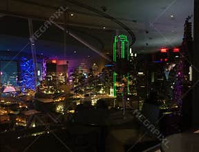Reflections on glass windows and downtown Dallas view from Reunion Tower Geo deck