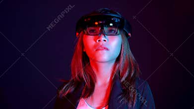 Business woman try vr glasses hololens in the dark room | Portrait of young asian girl experience ar communication | Future