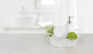 Purity concept with decorated bathroom accessories on stone table