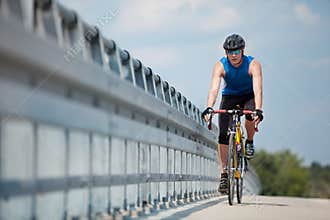 Biker riding on race road bike