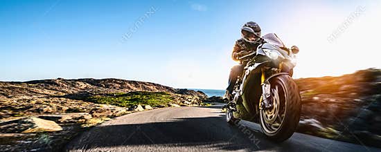 Motorbike on the coastal road riding. having fun driving the empty highway on a motorcycle tour journey