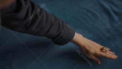 Smoothing silk velvet textile with brush and hand. Flattening piles of fabric. Plush soft material.