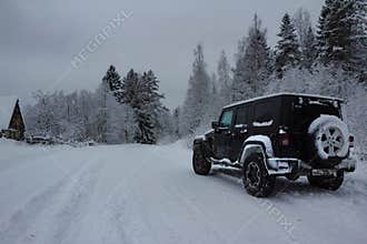 Jeep Wrangler jk on a snowy winter road