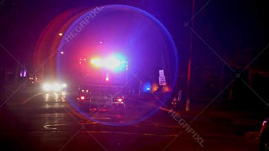 View of rear flashing lights of emergency service ambulance at nighttime Ambulances in front