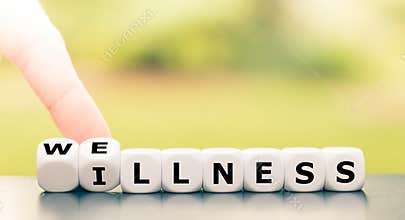 Hand turns dice and changes the word `illness` to `wellness`.