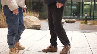 Close-up of a man recovering from a stroke, learning to walk again. Nearby is his girlfriend. Support and relationship