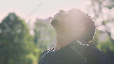 Handsome muscular Afro man resting after intense workout
