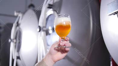 Small business and manufacturing concept. Brewers testing beer at brewery