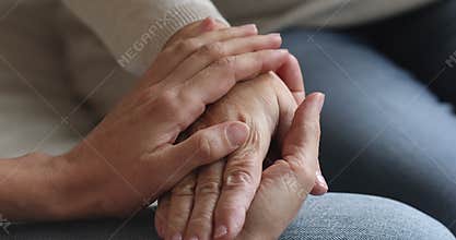 Grown up devoted daughter supporting senior old mother.