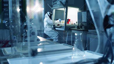 A worker researches coronavirus, developing a vaccine.