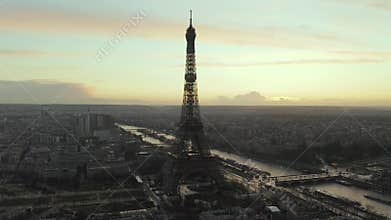 AERIAL: Drone Slowly Circling Eiffel Tower, Tour Eiffel in Paris, France with view on Seine River in Beautiful Sunset