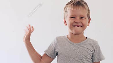 Boy waving by hand