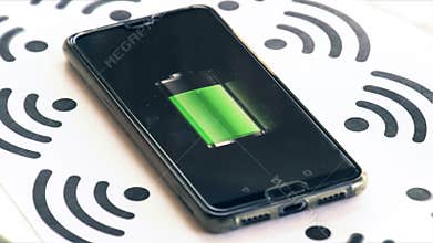 Wi-fi charging phone charger rotating with wireless symbols and battery icon background