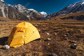 Yellow tent at Kongma Dingma campsite between Mera peak and Amphulapcha high pass, Himalaya mountains range in Nepal