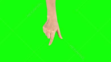 Female hand is performing spread and single tap at tablet screen gesture on green screen. Close up