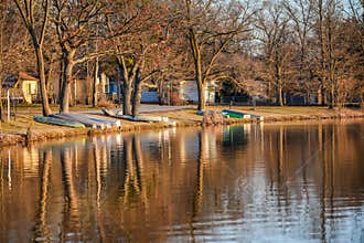 Tree and Boat Reflections on Lake