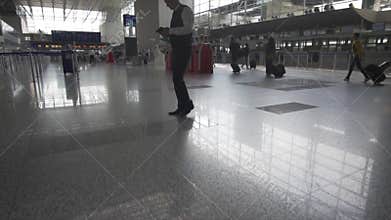 Busy Airport Main Hall with Business people and Suitcases