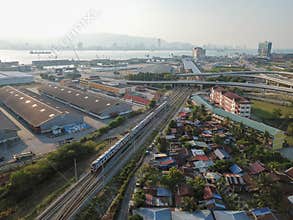 Electric Train Service ETS is move near the rural village near Penang Sentral.