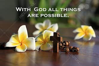 Inspiratinal quote - With God all things are possible. With rosary beads and flowers. Beleive in God concept.