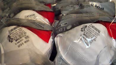 Slow motion of multiple N95 packs of respirator mask for the scare of Coronavirus epidemic around the World