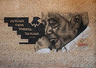 Mural featuring Cesar Chavez in Deep Ellum, Dallas, by renowned artist Ponchaveli.