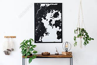 Scandinavian living room with wooden console table and map poster.