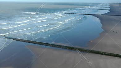 Aeral view of the waves of the calm north sea sandy beaches