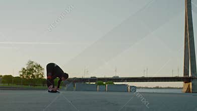 Professional sportsman does hard workout alone.