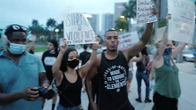 Miami Downtown, FL, USA - JUNE 7, 2020: Black people dance during protests in the streets of Miami. Demonstrations