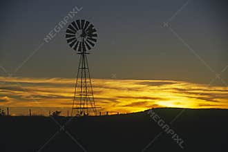 Old windmill at sunset