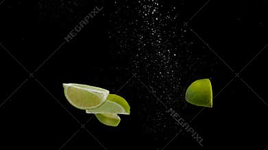 Fresh Sliced Lime Falling Into Water