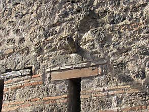 Phallus shaped object above brothel door in Pompeii