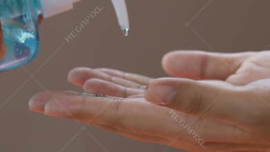 Washing hand by alcohol gel from bottle pump for anti coronavirus.