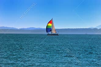 A yacht with a bright sail.