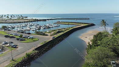 Aerial drone motion towards twin arched bridge over the river Anahulu in Haleiwa on Oahu