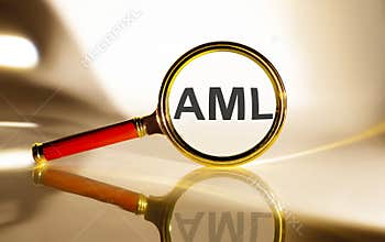 AML concept. Magnifier glass with text on white background in sunlight