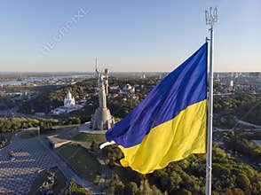 Aerial Drone Flyby Shot in Kyiv - Biggest National flag of Ukraine. Aerial view. Spivoche Pole, Kiev