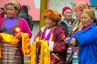 Old woman at traditional Buddha anniversary celebration ceremony in Nepal