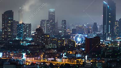 Skyscraper tower buildings in Bangkok city center with ferris wheels, cityscape view. Asia travel destination