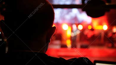 Sound and lighting engineer at an outdoor festival concert