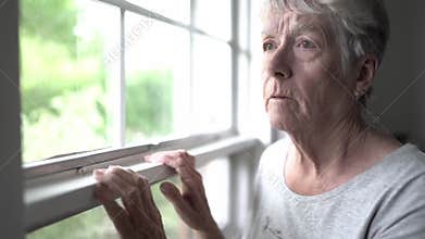 A Portrait of sad lonely pensive old senior woman